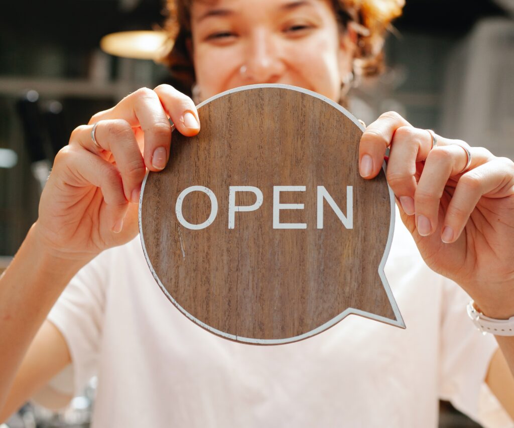 Employee setting personal and professional Boundaries with an open sign